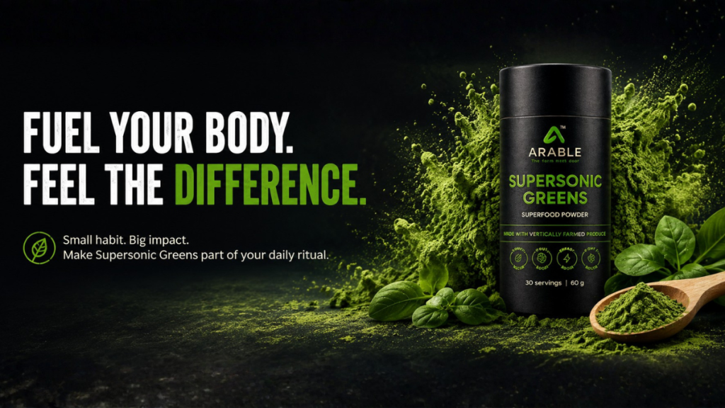 Supersonic Greens tube with green powder and fresh leaves